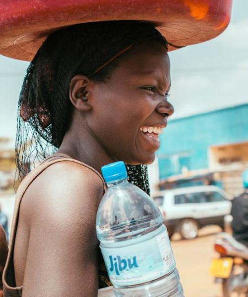 jibu partners with local entrepreneurs to produce and distribute safe drinking water within their communities.