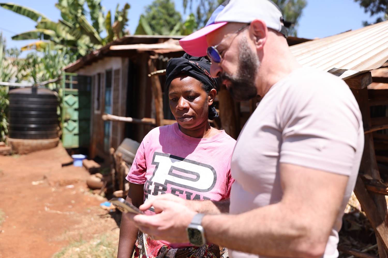 Joyce, a farmer from Kenya, and Andre, Kiva's Board Chair