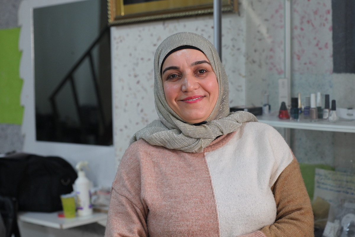Intesar, a Syrian refugee living in Turkey, took a loan to fund her hairdressing salon