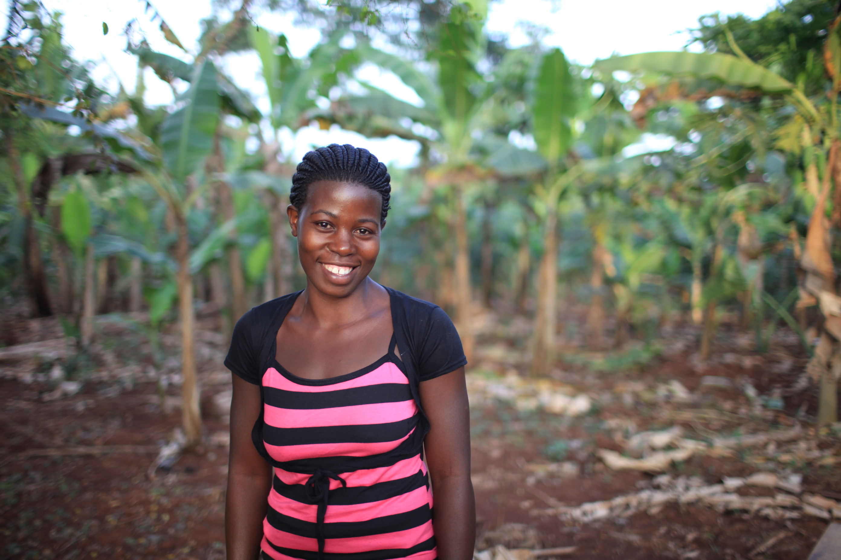 A kiva loan of $325 helped Alice to purchase a mobile phone, a solar charging set, and a weighing scale, so that she may provide vital farming information to her community.