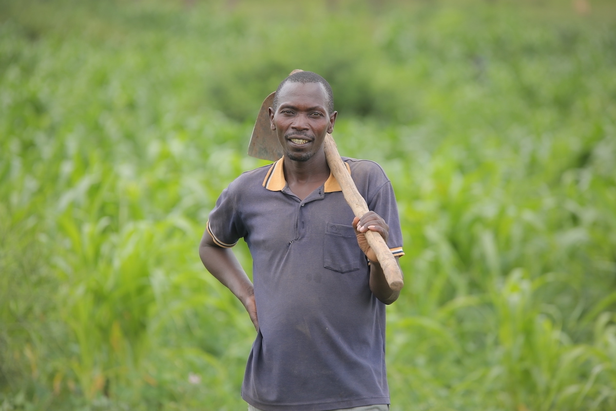 With the help of a Kiva loan through UGAFODE, John was able to invest in both his farming and motorcycle businesses to improve his income. As a result, he is able to send his children to school. 
