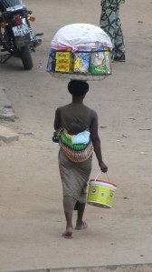 Why should a mom tie her baby to her back in Togo?