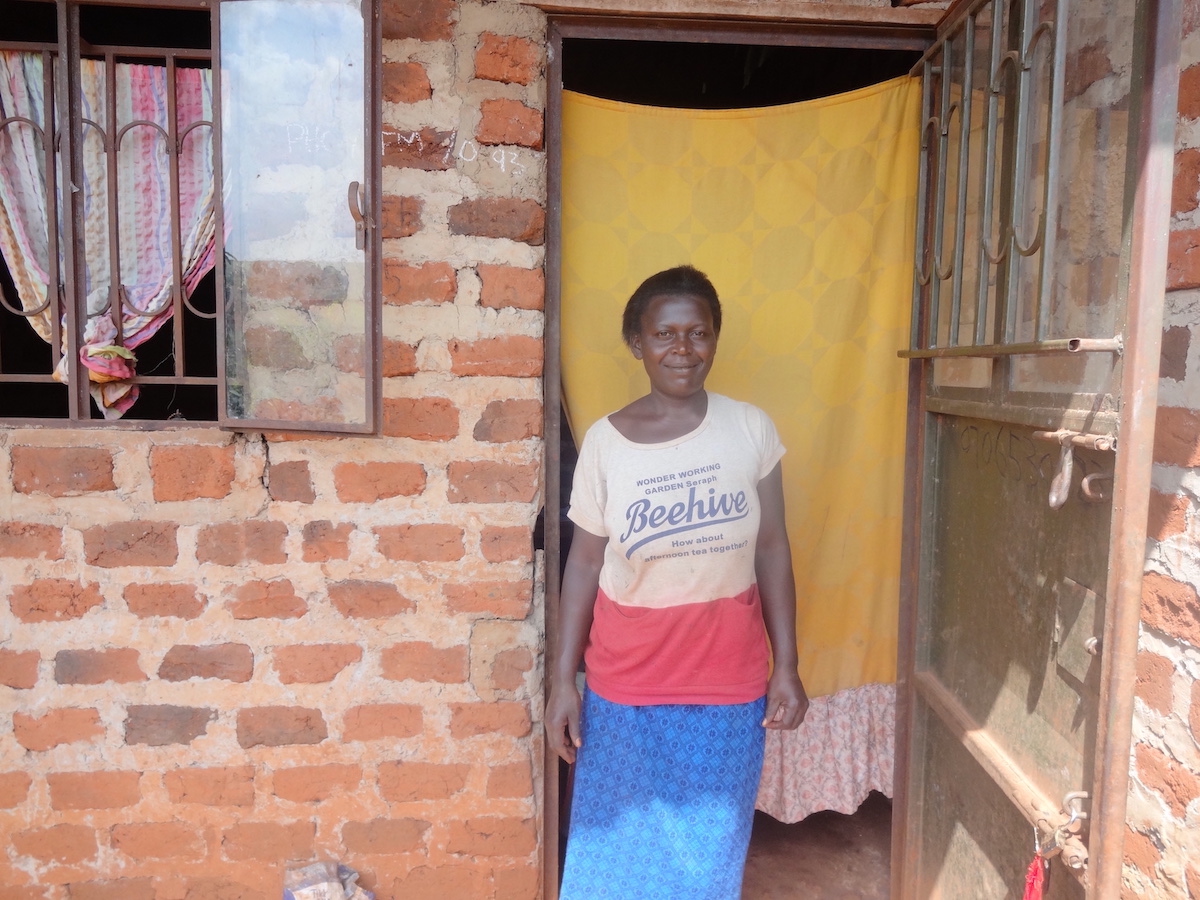 Alayisa took a Kiva loan through UGAFODE to purchase more items for her used clothing business.