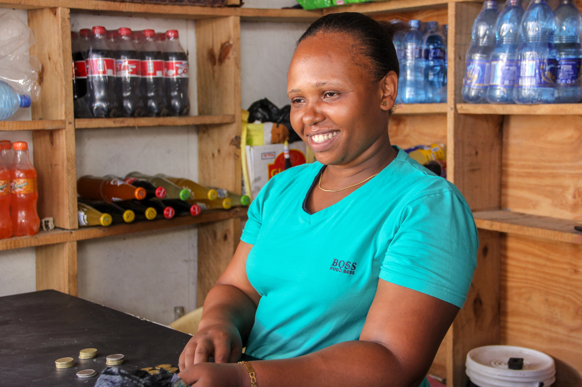 A Kiva loan of $650 to Mery Hasan of Faru 1 Group helped her to  buy more cartons of mineral water, crates of soda, boxes of juice, and crates of soda.