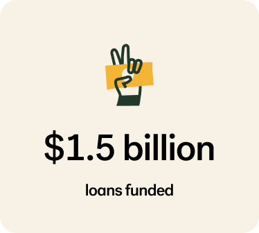 Peace sign hand illustration over $1.5 billion loans funded data